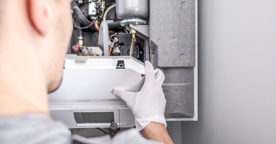 man doing heating maintenance